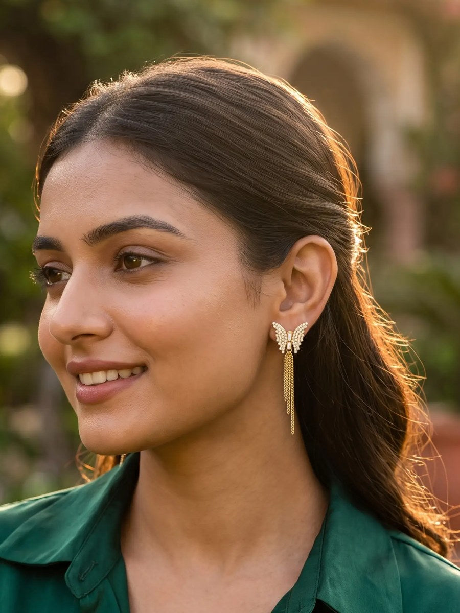 Model wearing gold Pusha earrings